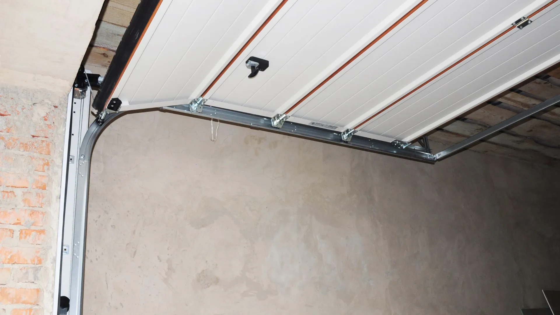 Garage door torsion spring and rail assembly